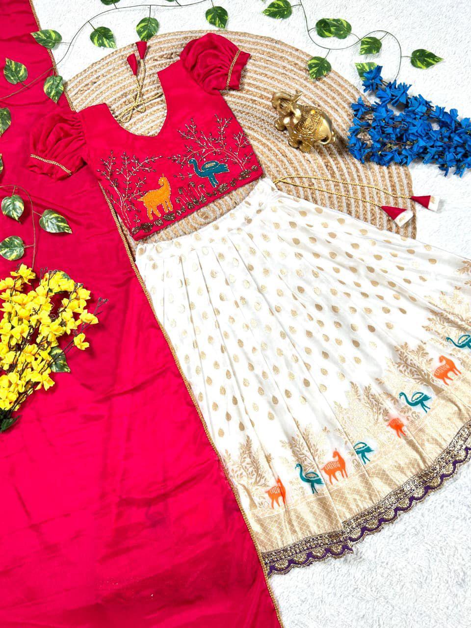 Girls Maggam work blouse paired with a golden zari pure tissue silk skirt