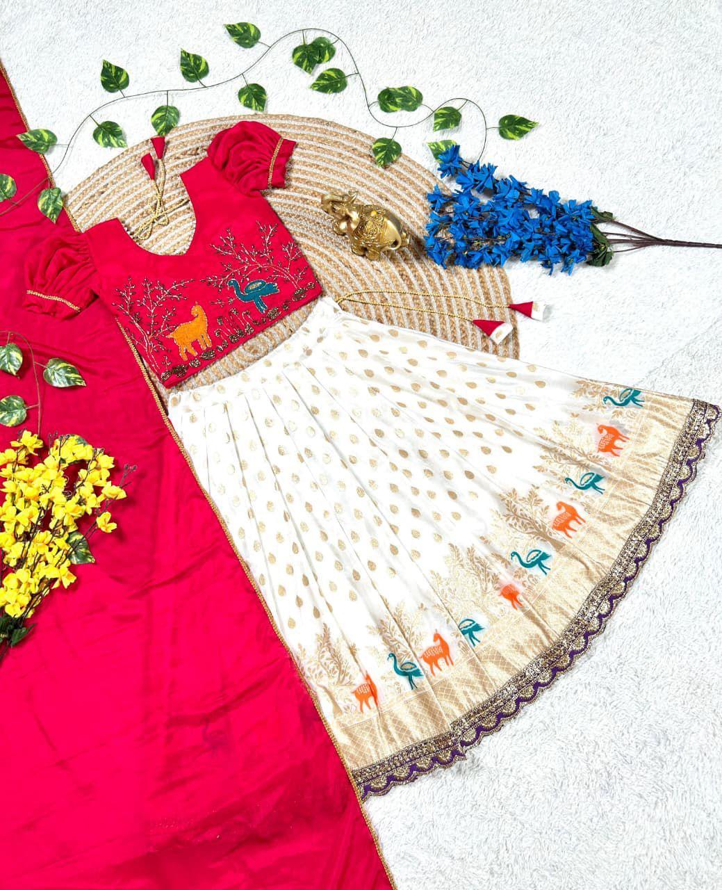 Girls Maggam work blouse paired with a golden zari pure tissue silk skirt