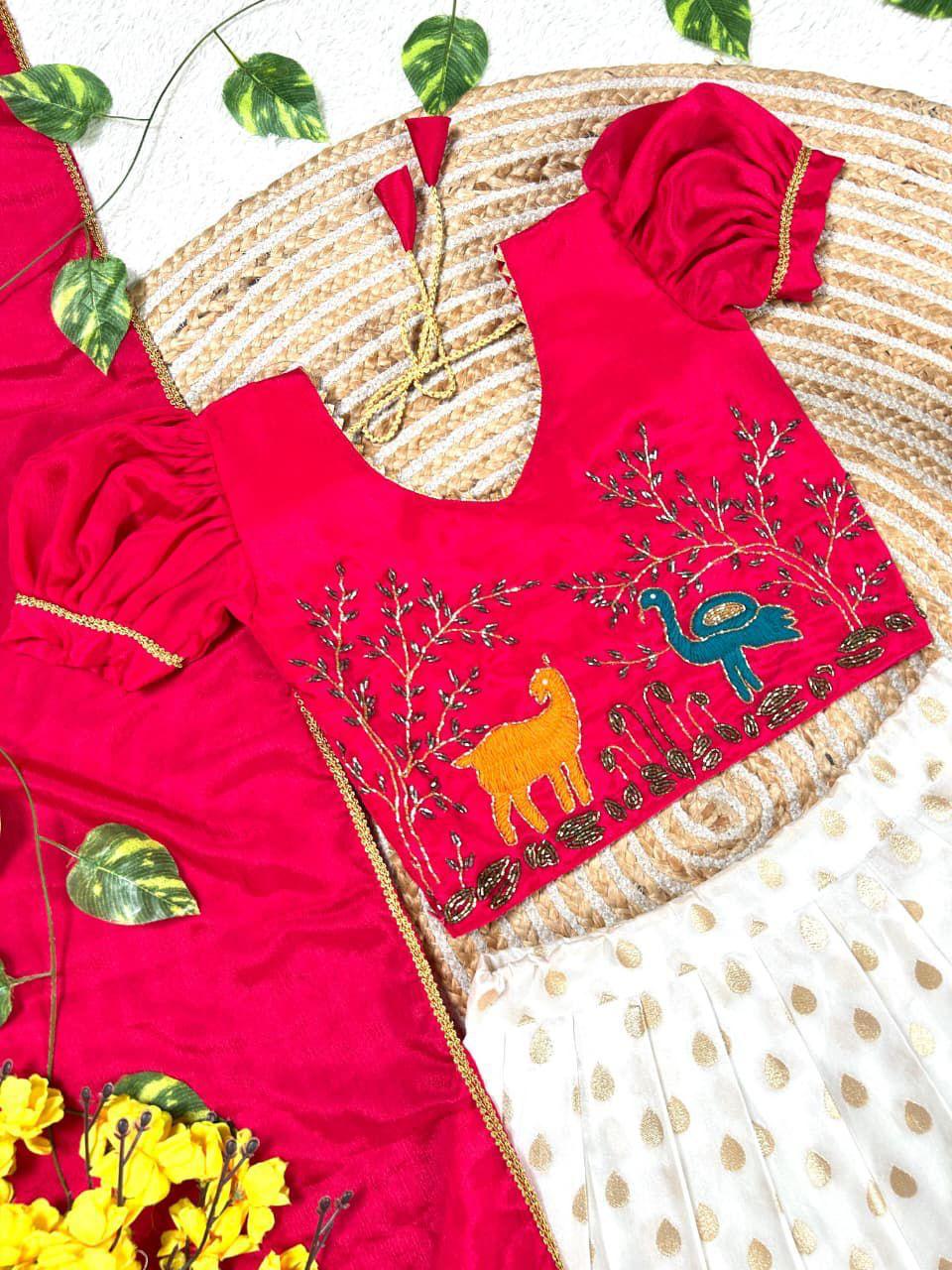 Girls Maggam work blouse paired with a golden zari pure tissue silk skirt